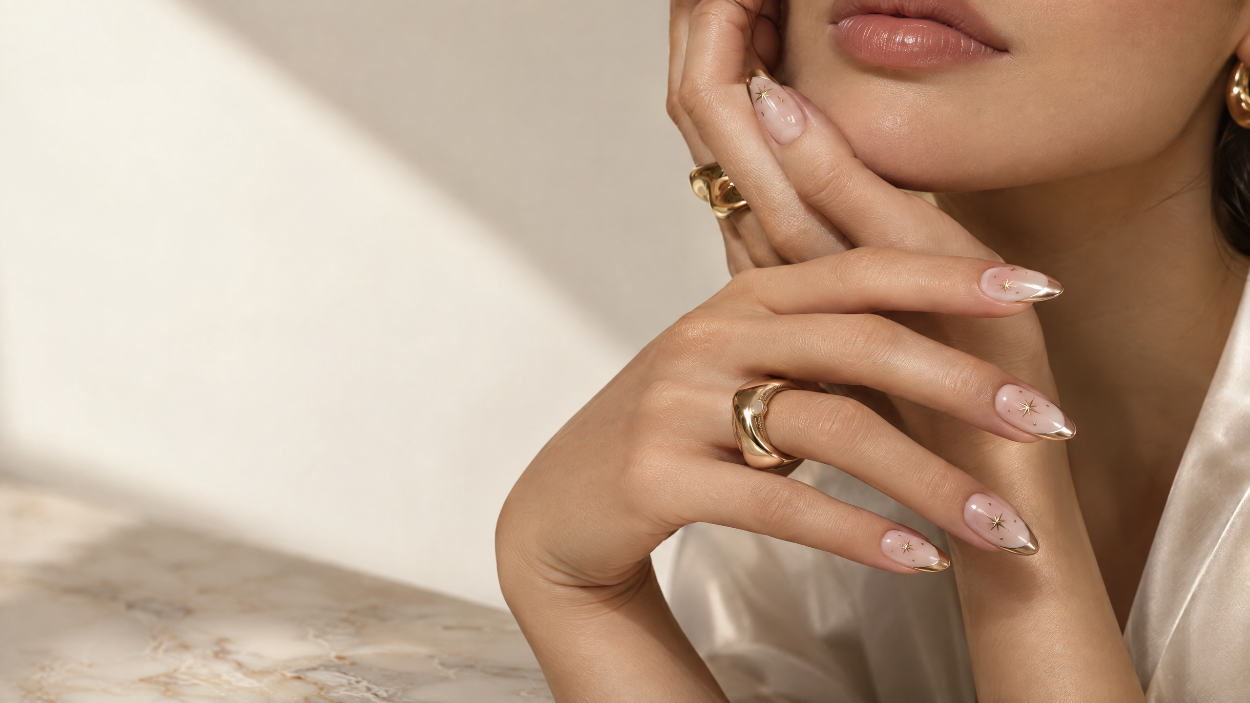 Blush chrome French manicure with gold star details